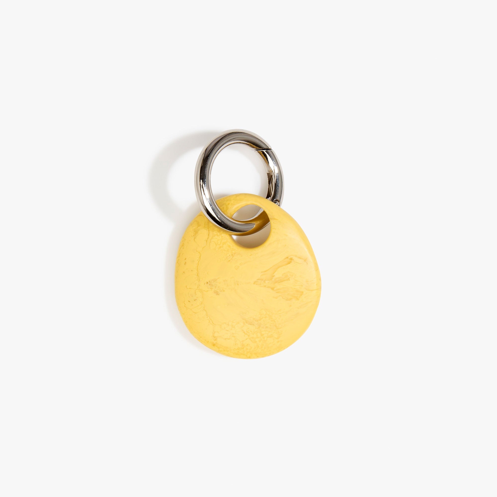 Dinosaur Designs Earth Keyring in Pollen — handcrafted marbled yellow and clear resin pebble bead on a polished gunmetal jump ring..