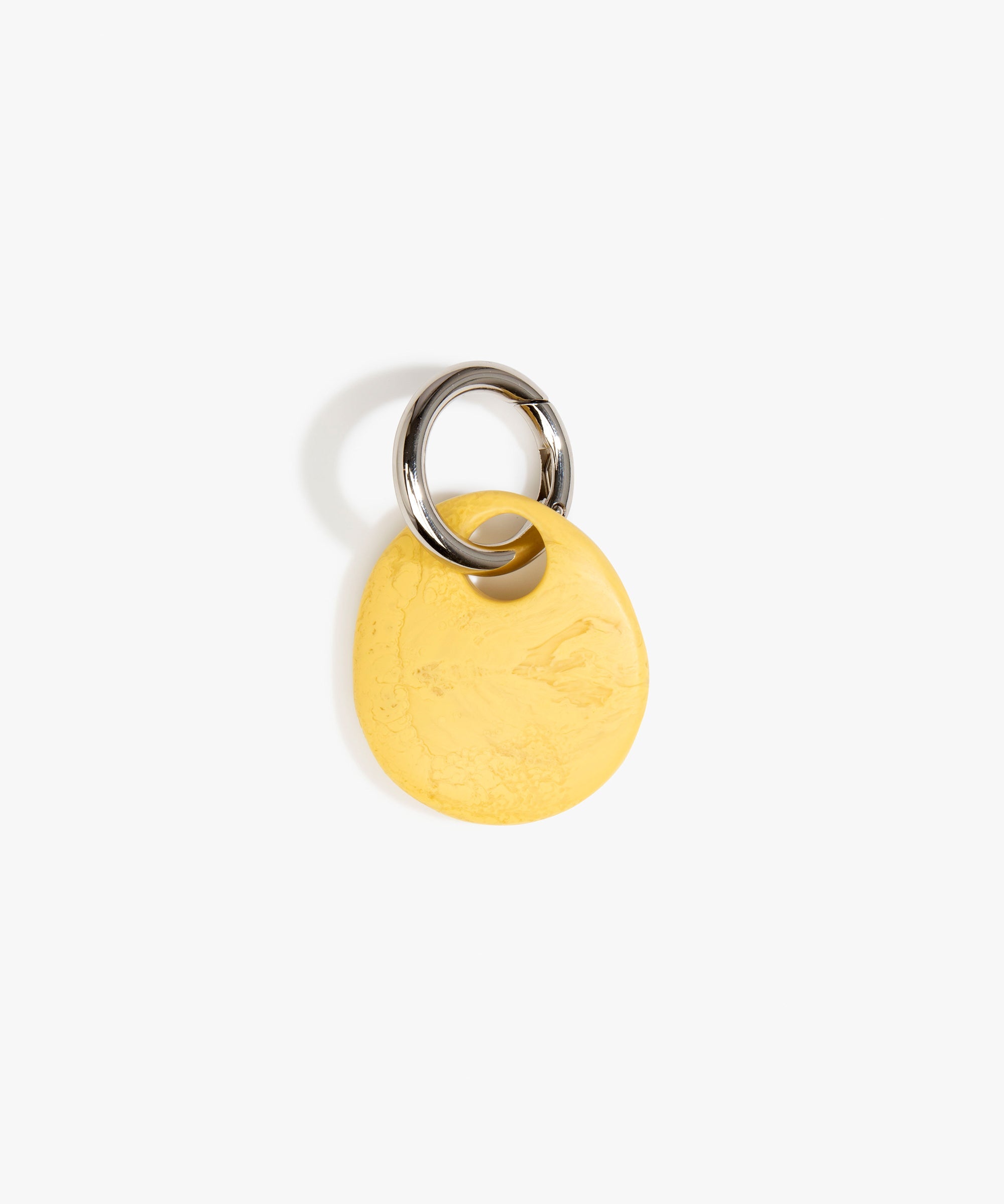 Dinosaur Designs Earth Keyring in Pollen — handcrafted marbled yellow and clear resin pebble bead on a polished gunmetal jump ring
