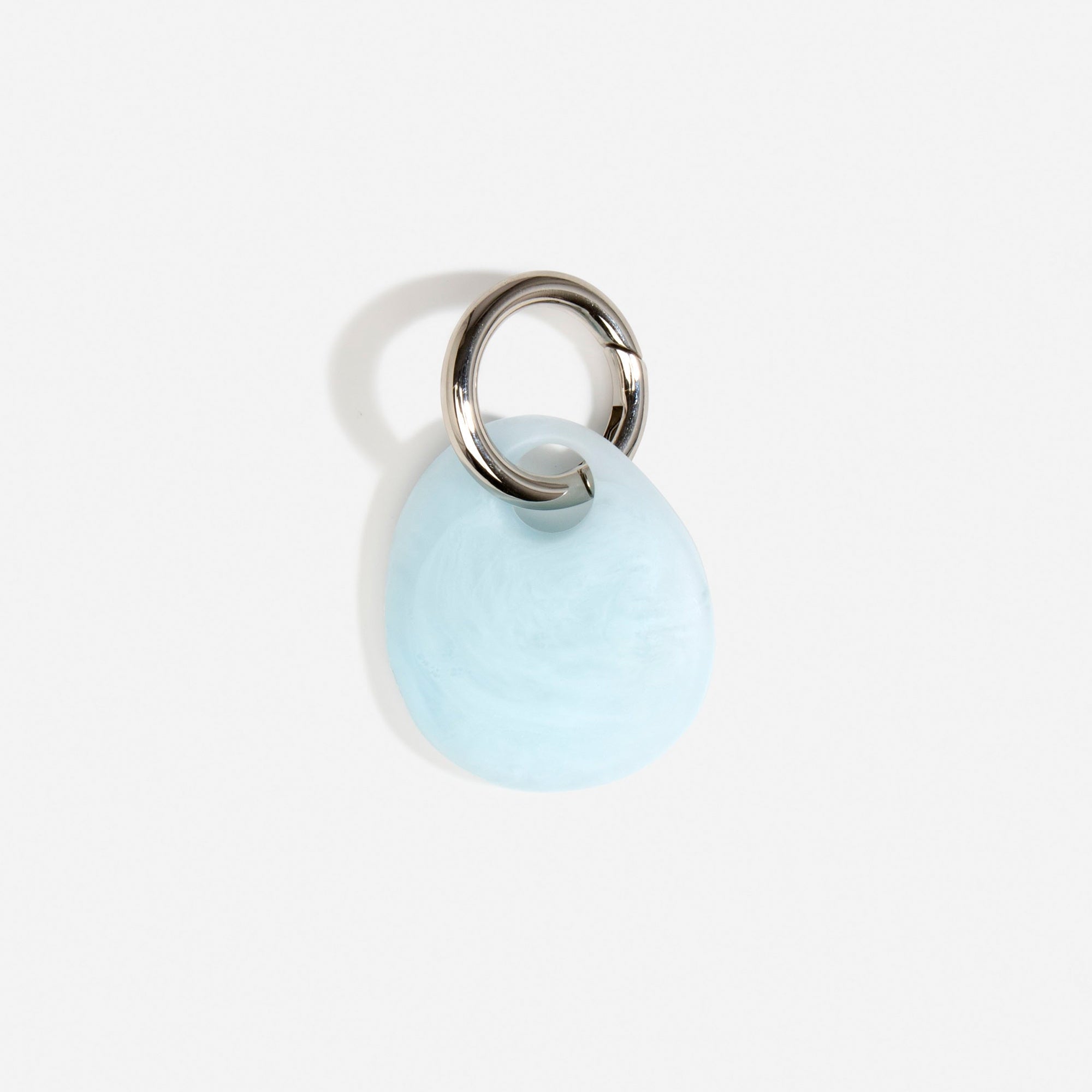 Dinosaur Designs Earth Keyring in Pool — handcrafted marbled blue and clear resin pebble bead on a polished gunmetal jump ring..