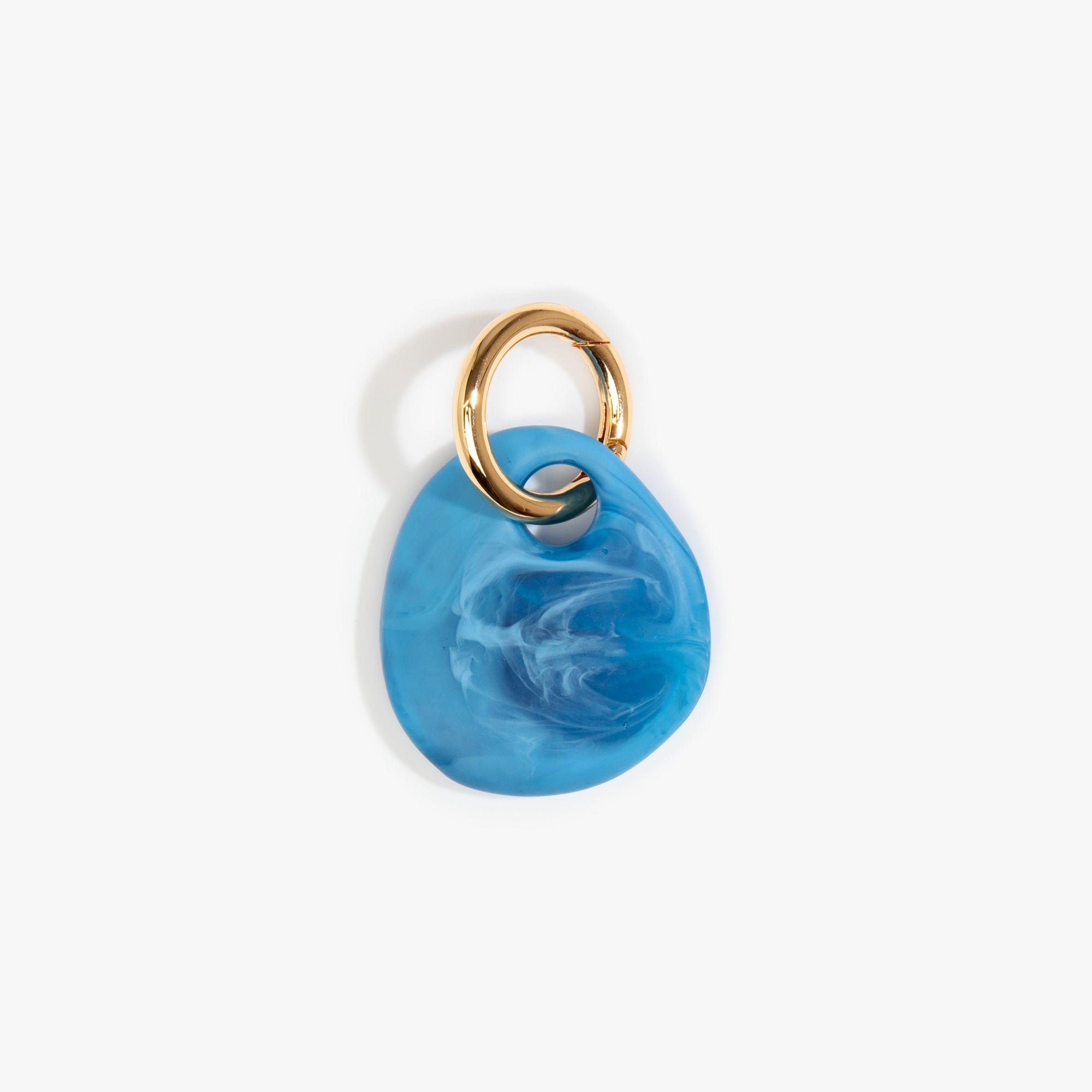 Dinosaur Designs Earth Keyring in Sky — handcrafted marbled blue and clear resin pebble bead on a polished brass jump ring..