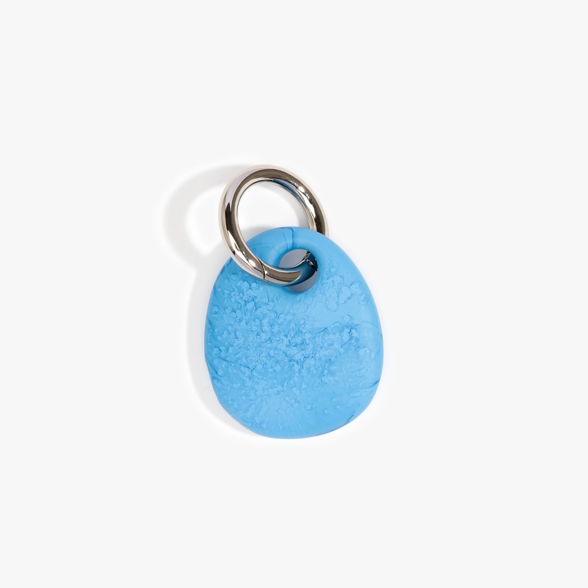 Dinosaur Designs Earth Keyring in Sky — handcrafted marbled blue and clear resin pebble bead on a polished gunmetal jump ring..