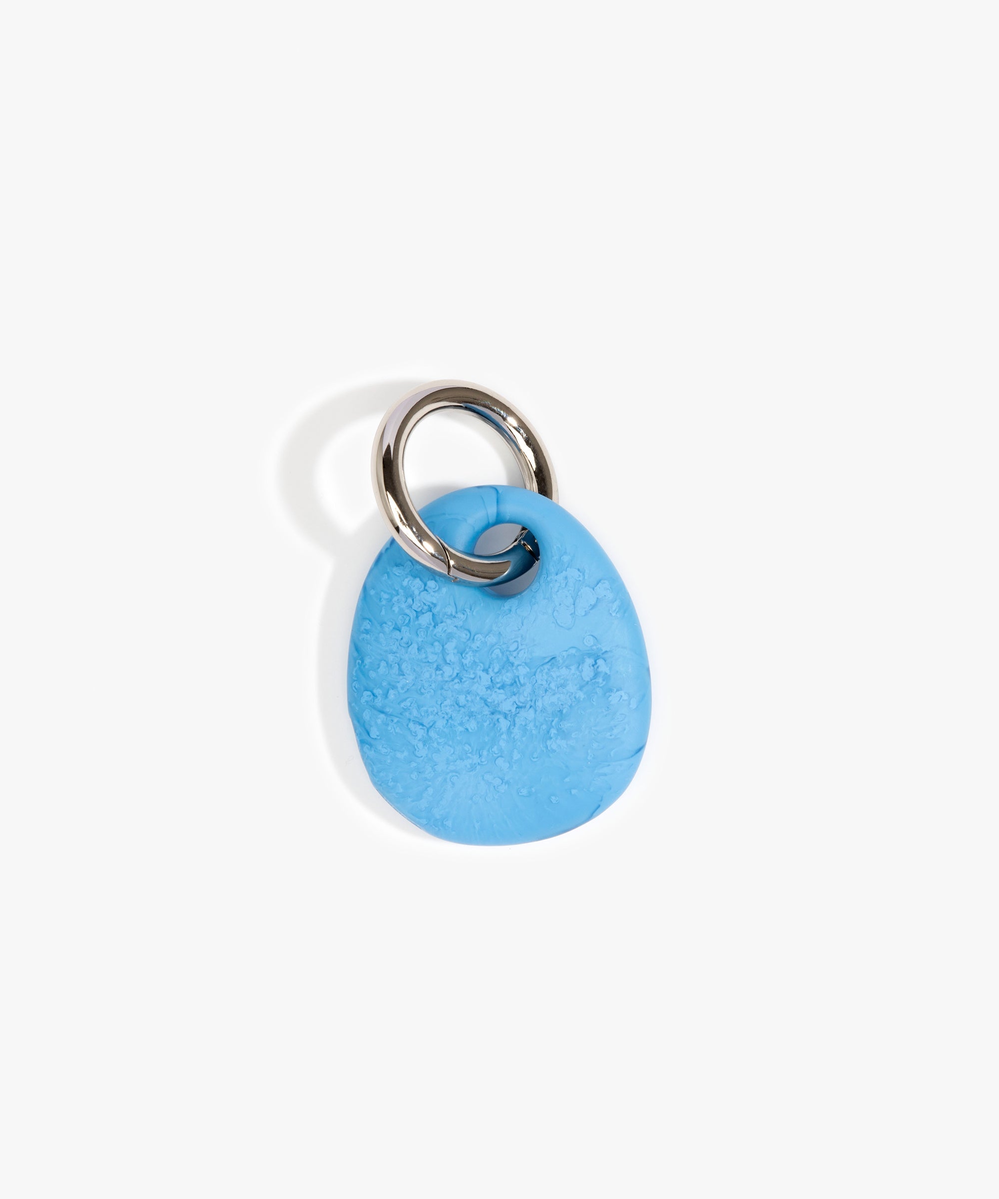 Dinosaur Designs Earth Keyring in Sky — handcrafted marbled blue and clear resin pebble bead on a polished gunmetal jump ring..