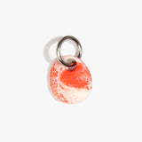 Dinosaur Designs Earth Keyring in Strawberry — handcrafted marbled light and dark red resin pebble bead on a polished gunmetal jump ring..