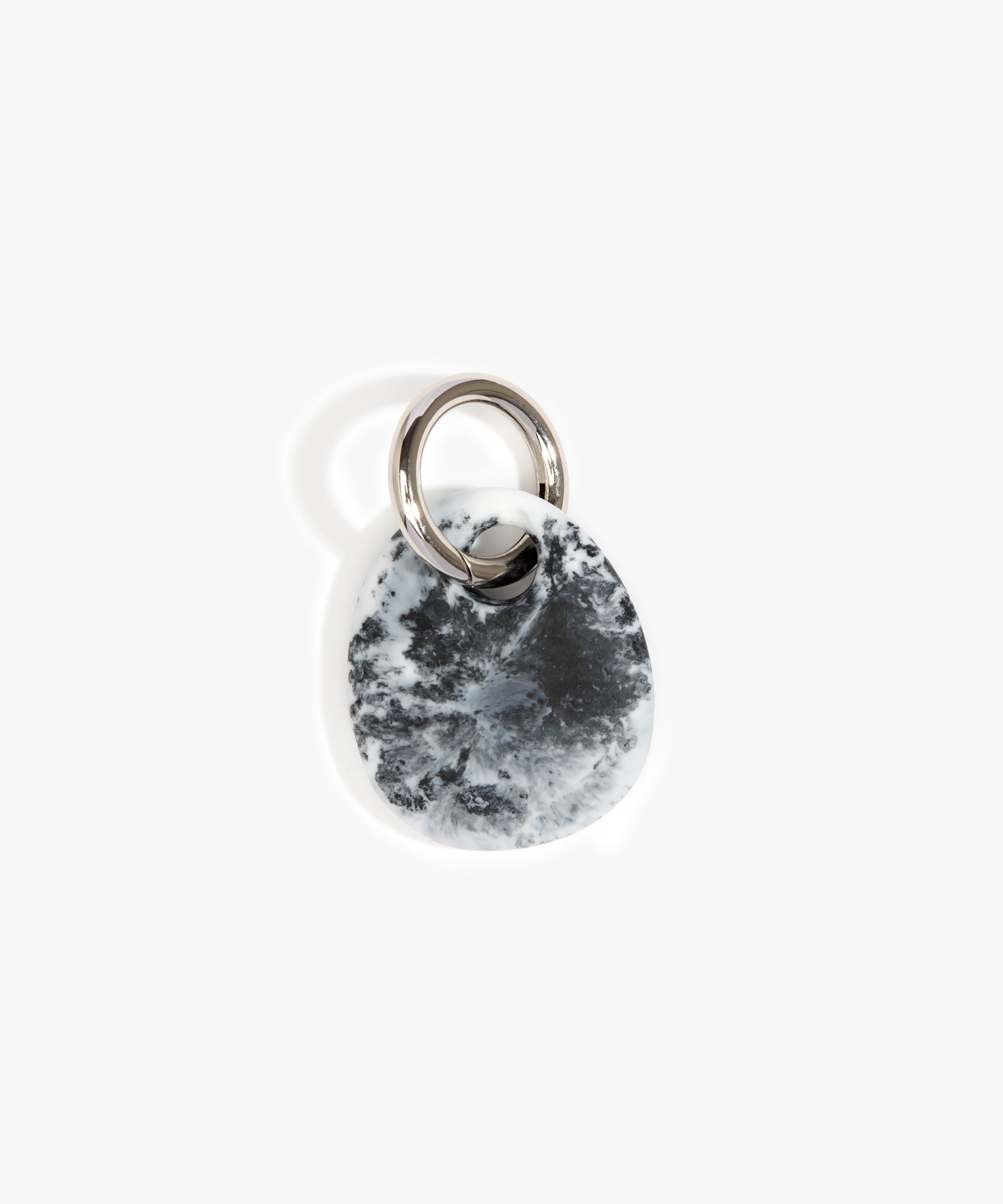 Dinosaur Designs Earth Keyring in White Marble — handcrafted marbled white and Black resin pebble bead on a polished gunmetal jump ring..