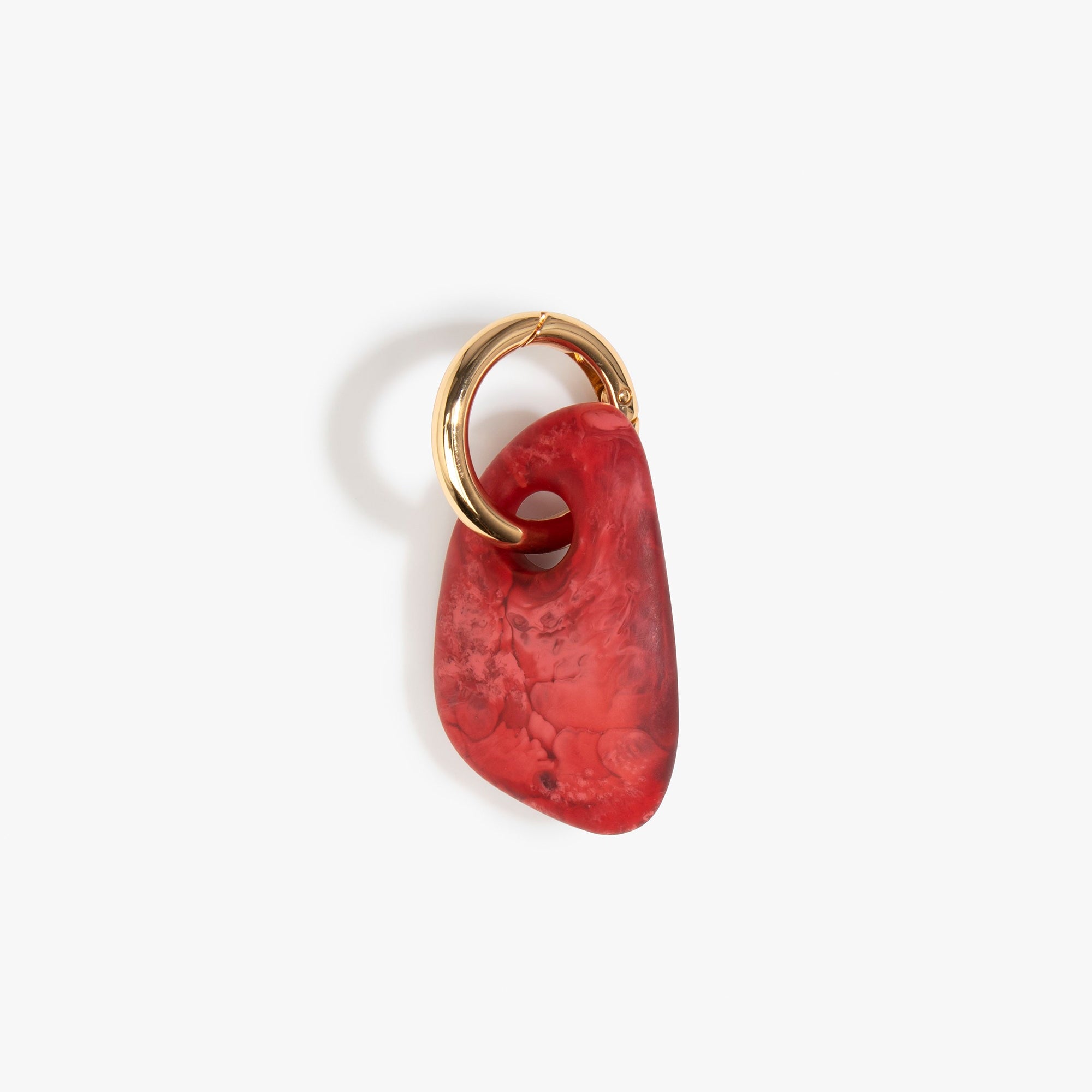 Dinosaur Designs Rock Keyring in Cranberry — handcrafted marbled red resin pebble bead on a polished brass jump ring..