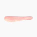 Dinosaur Designs Temple Cake Knife in Blossom — handcrafted marbled pink and cream resin cake knife with smooth tapered blade and rounded handle.