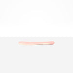 Dinosaur Designs Temple Cake Knife in Blossom — handcrafted marbled pink and cream resin cake knife with smooth tapered blade and rounded handle.