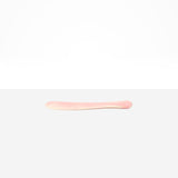 Dinosaur Designs Temple Cake Knife in Blossom — handcrafted marbled pink and cream resin cake knife with smooth tapered blade and rounded handle.