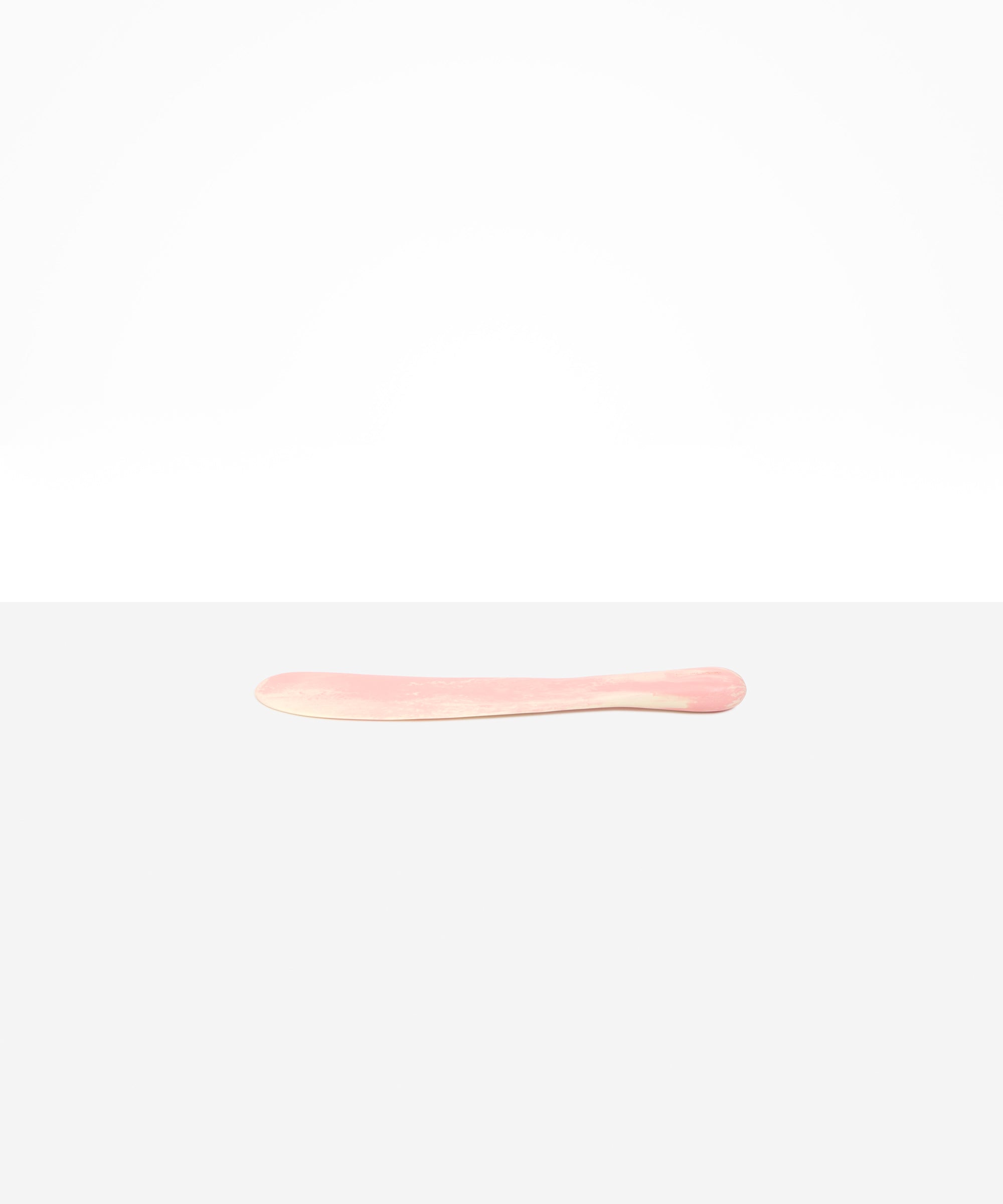 Dinosaur Designs Temple Cake Knife in Blossom — handcrafted marbled pink and cream resin cake knife with smooth tapered blade and rounded handle.