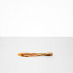 Dinosaur Designs Temple Cake Knife in Light Horn — handcrafted marbled brown, cream and clear resin cake knife with smooth tapered blade and rounded handle.