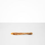 Dinosaur Designs Temple Cake Knife in Light Horn — handcrafted marbled brown, cream and clear resin cake knife with smooth tapered blade and rounded handle.