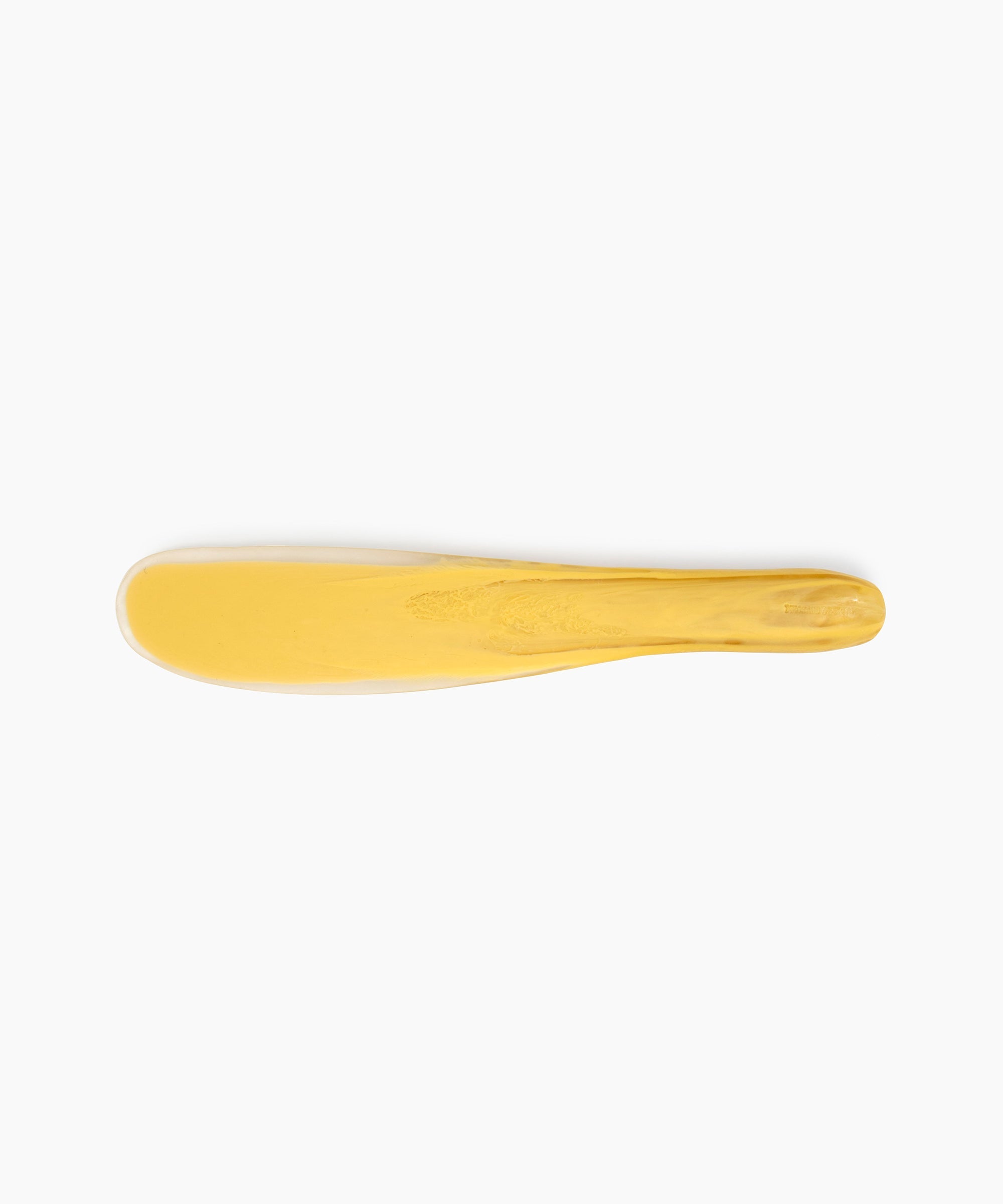 Dinosaur Designs Temple Cake Knife in Pollen — handcrafted marbled yellow and clear resin cake knife with smooth tapered blade and rounded handle.