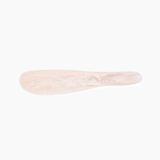 Dinosaur Designs Temple Cake Knife in Rose Swirl — handcrafted marbled dusty pink resin cake knife with smooth tapered blade and rounded handle.