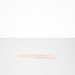 Dinosaur Designs Temple Cake Knife in Rose Swirl — handcrafted marbled dusty pink resin cake knife with smooth tapered blade and rounded handle.