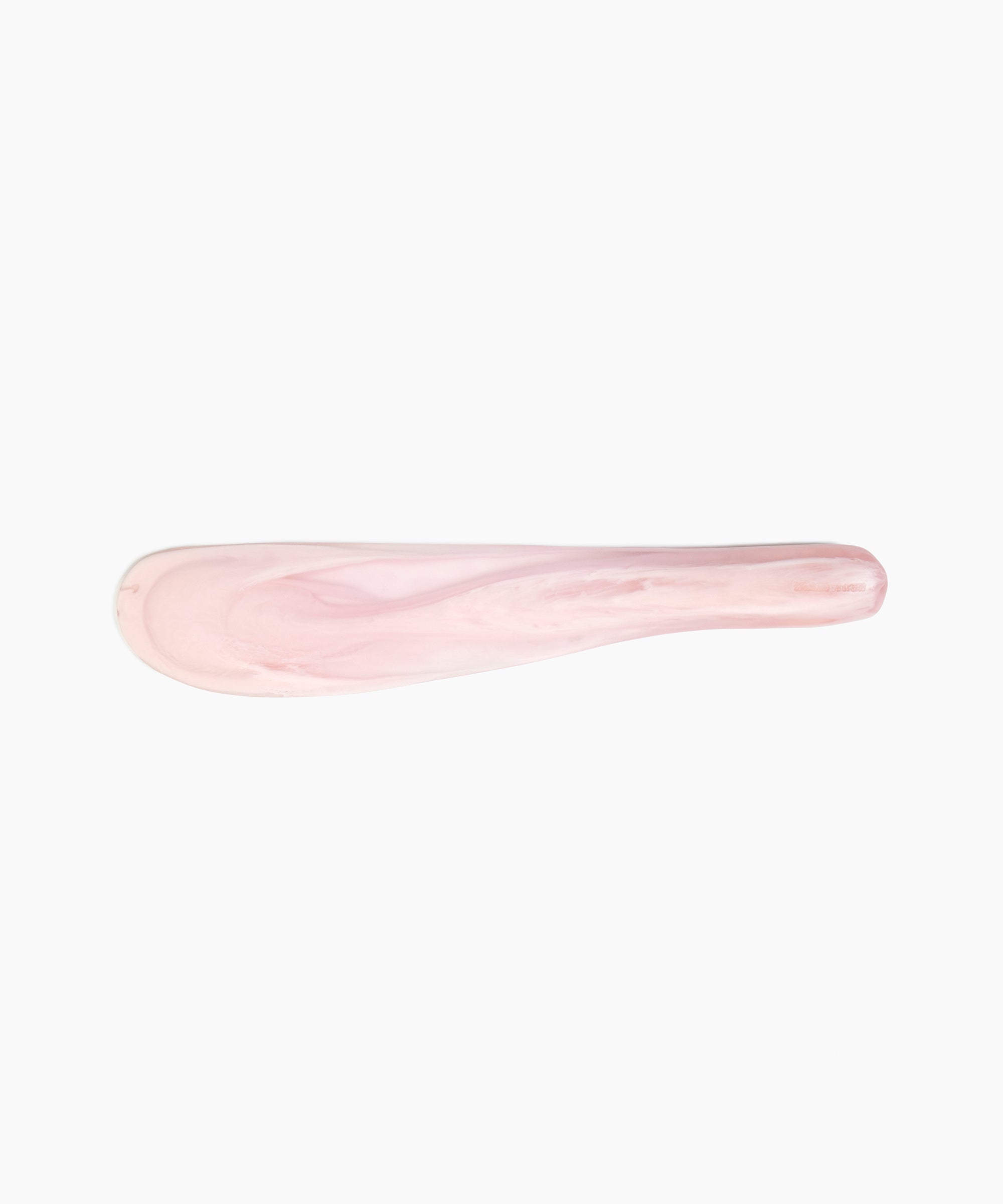 Dinosaur Designs Temple Cake Knife in Shell Pink — handcrafted marbled pale pink resin cake knife with smooth tapered blade and rounded handle.