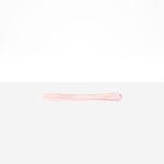 Dinosaur Designs Temple Cake Knife in Shell Pink — handcrafted marbled pale pink resin cake knife with smooth tapered blade and rounded handle.