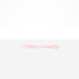 Dinosaur Designs Temple Cake Knife in Shell Pink — handcrafted marbled pale pink resin cake knife with smooth tapered blade and rounded handle.