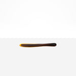 Dinosaur Designs Temple Cake Knife in Tortoise — handcrafted marbled amber and black resin cake knife with smooth tapered blade and rounded handle.