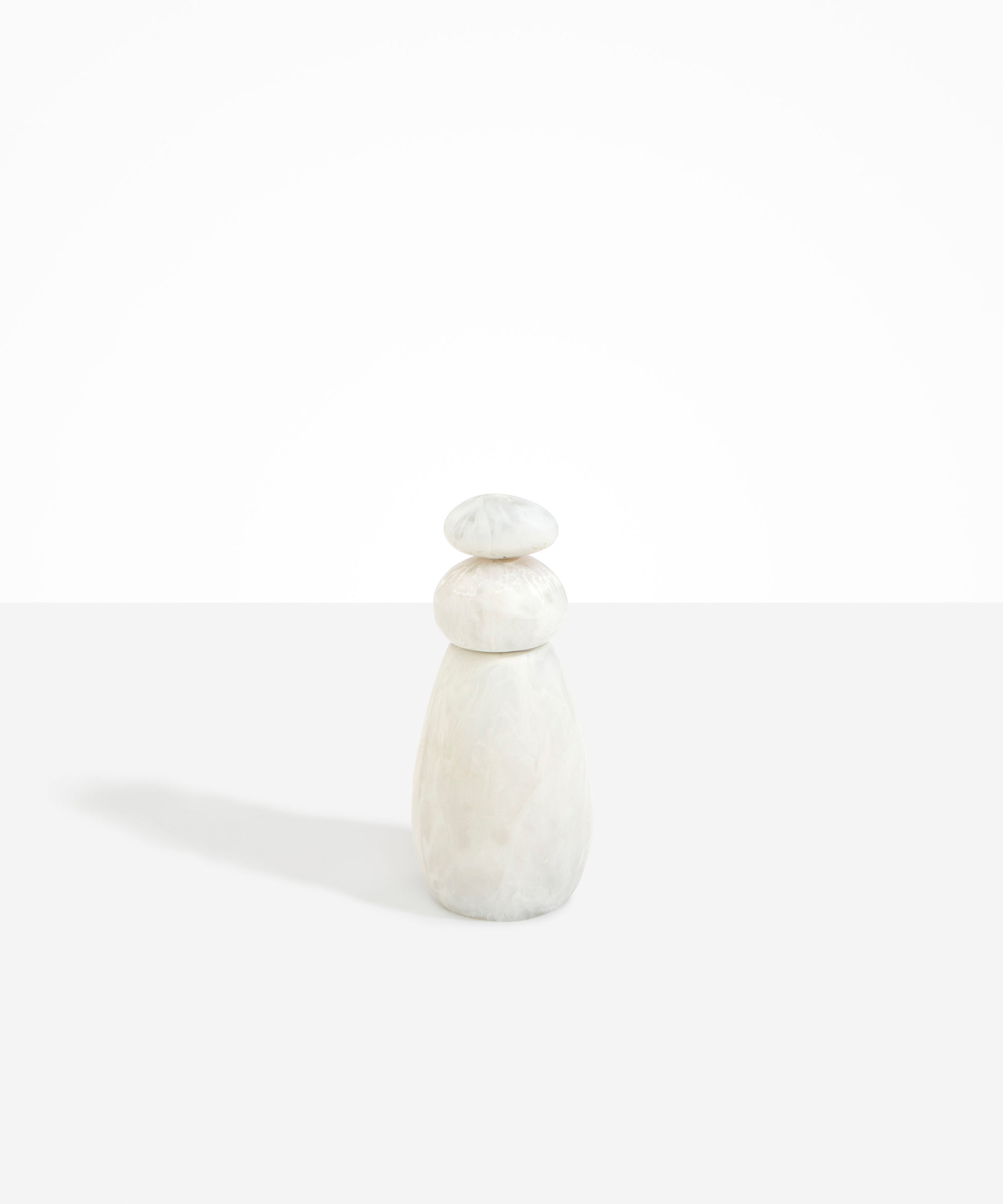Dinosaur Designs Tall Pepper Boulder Grinder in Chalk Swirl — handcrafted marbled off-white resin pepper grinder with elongated teardrop body and stacked pebble lid