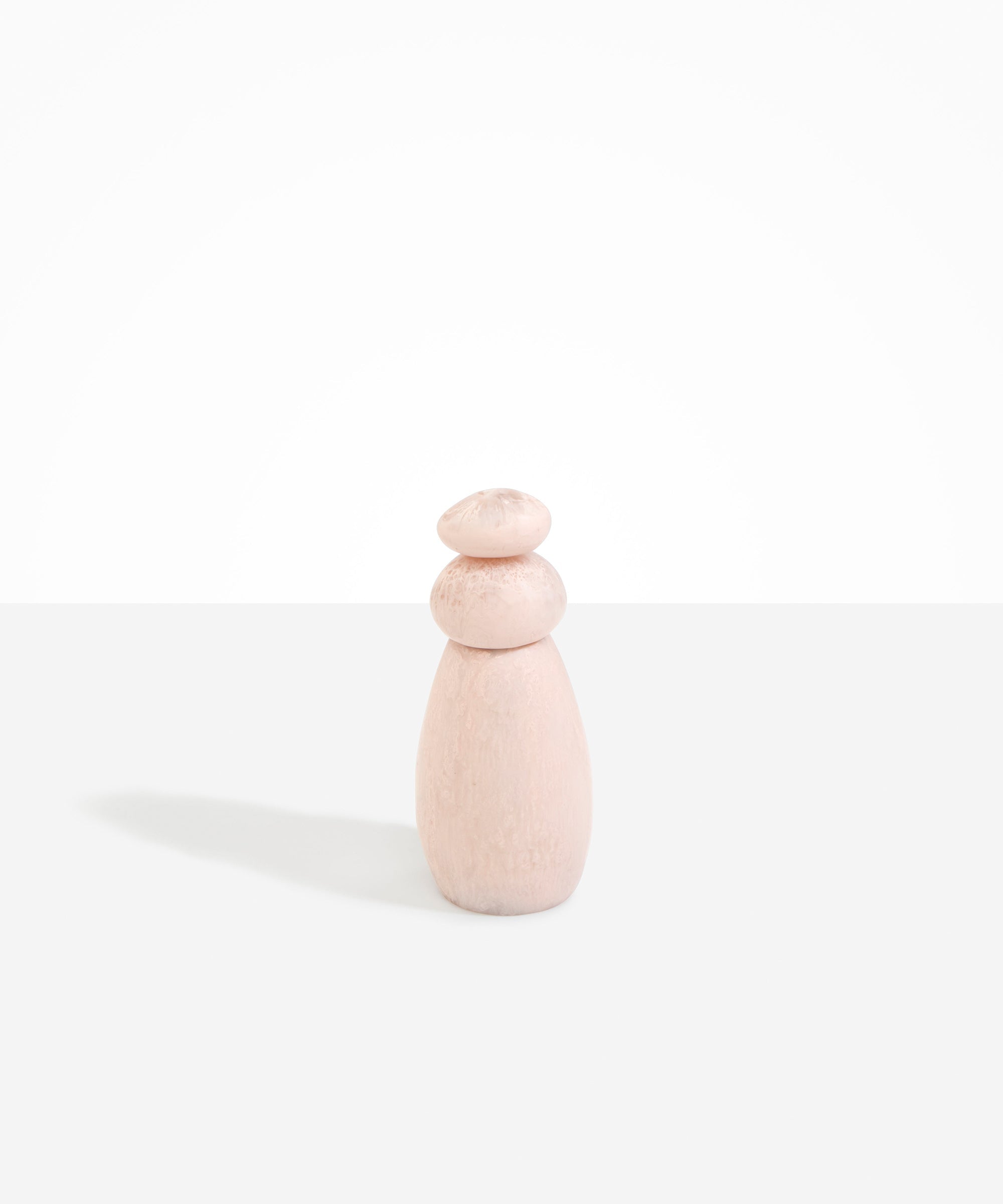 Dinosaur Designs Tall Pepper Boulder Grinder in Rose Swirl — handcrafted marbled dusty pink resin pepper grinder with elongated teardrop body and stacked pebble lid