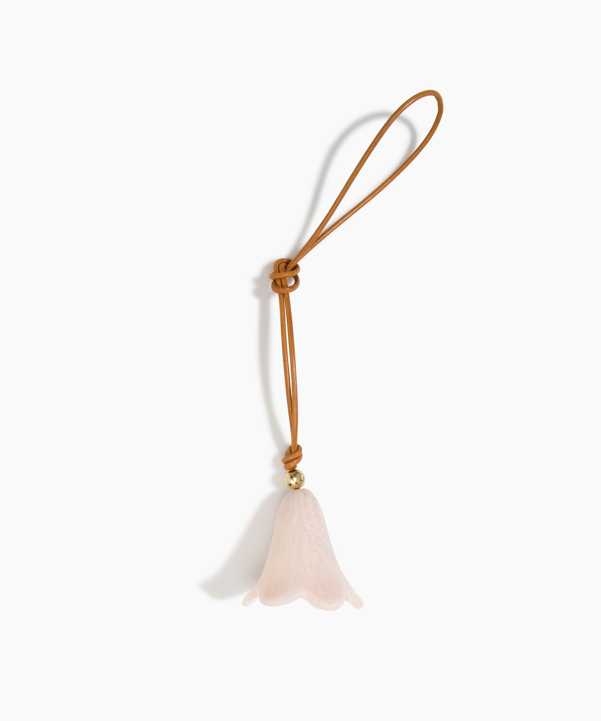 Dinosaur Designs Flower Bag Charm in Rose Swirl colour with Brass bead — handcrafted marbled dusty pink resin bell-shaped flower bag charm with tan leather hanging loop and brass bead