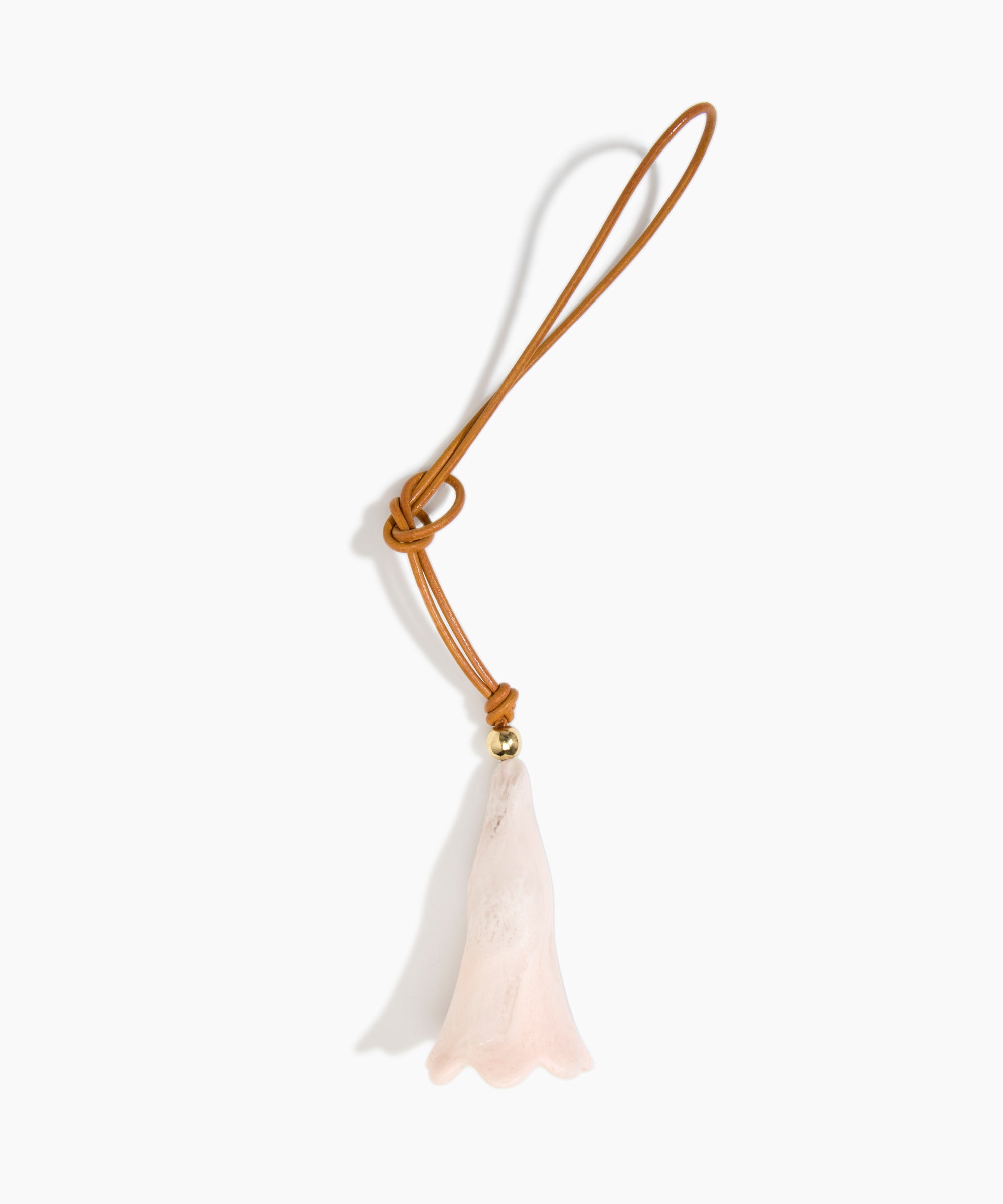 Dinosaur Designs Long Flower Bag Charm in Rose Swirl colour with Brass bead — handcrafted marbled dusty pink resin bell-shaped flower bag charm with tan leather hanging loop and brass bead