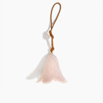 Dinosaur Designs Flower Decoration in Rose Swirl colour with Brass bead — handcrafted marbled dusty pink resin bell-shaped flower ornament with tan leather hanging loop and brass bead