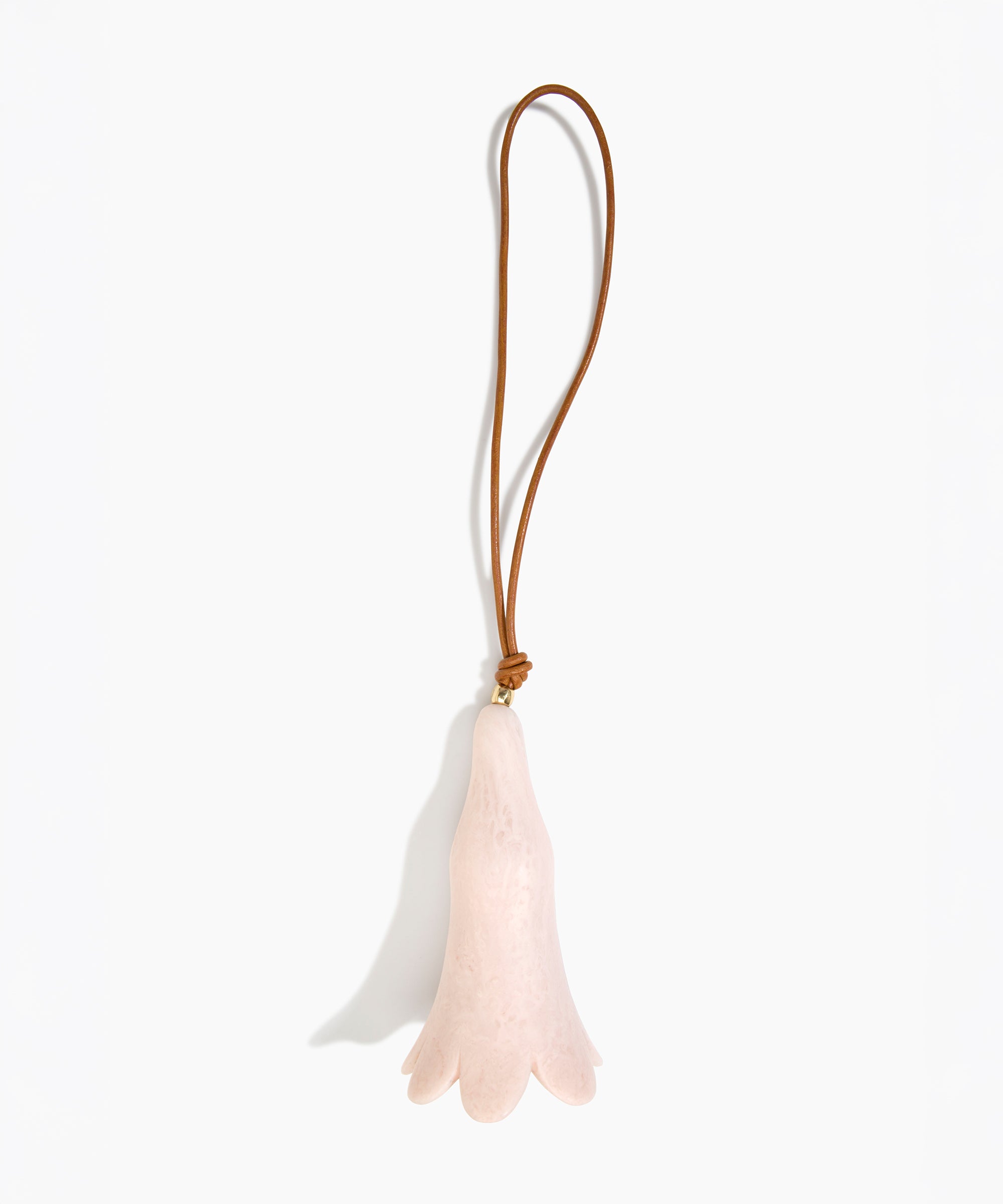 Dinosaur Designs Long Flower Decoration in Rose Swirl colour with Brass bead — handcrafted marbled dusty pink resin bell-shaped flower ornament with tan leather hanging loop and brass bead