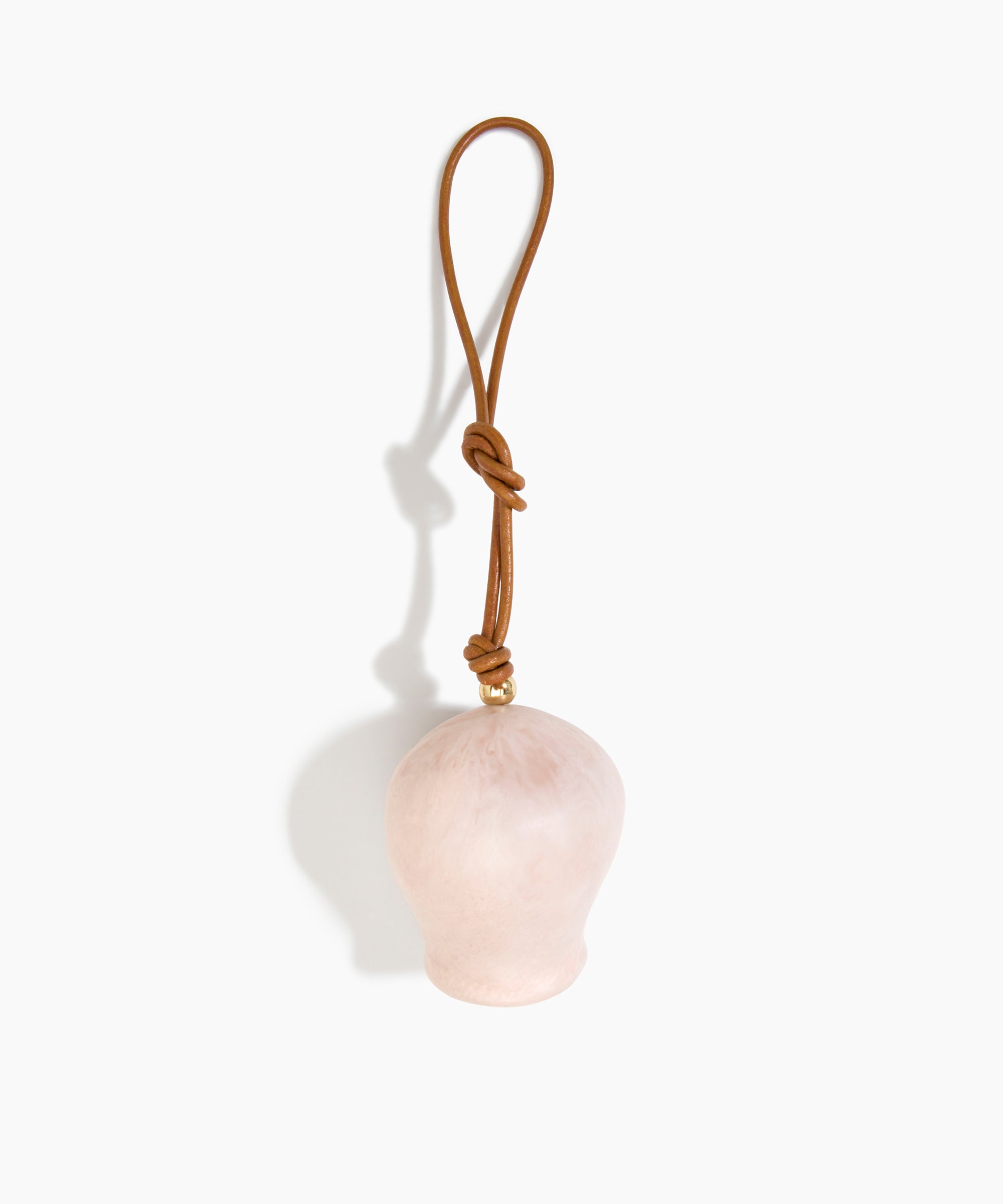 Dinosaur Designs Gumnut Decoration in Rose Swirl colour with Brass hardware — handcrafted marbled dusty pink resin gumnut-shaped ornament with tan leather hanging loop and brass bead