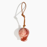Dinosaur Designs Gumnut Decoration in Rust colour with Brass hardware — handcrafted marbled terracotta red and cream resin gumnut-shaped ornament with tan leather hanging loop and brass bead
