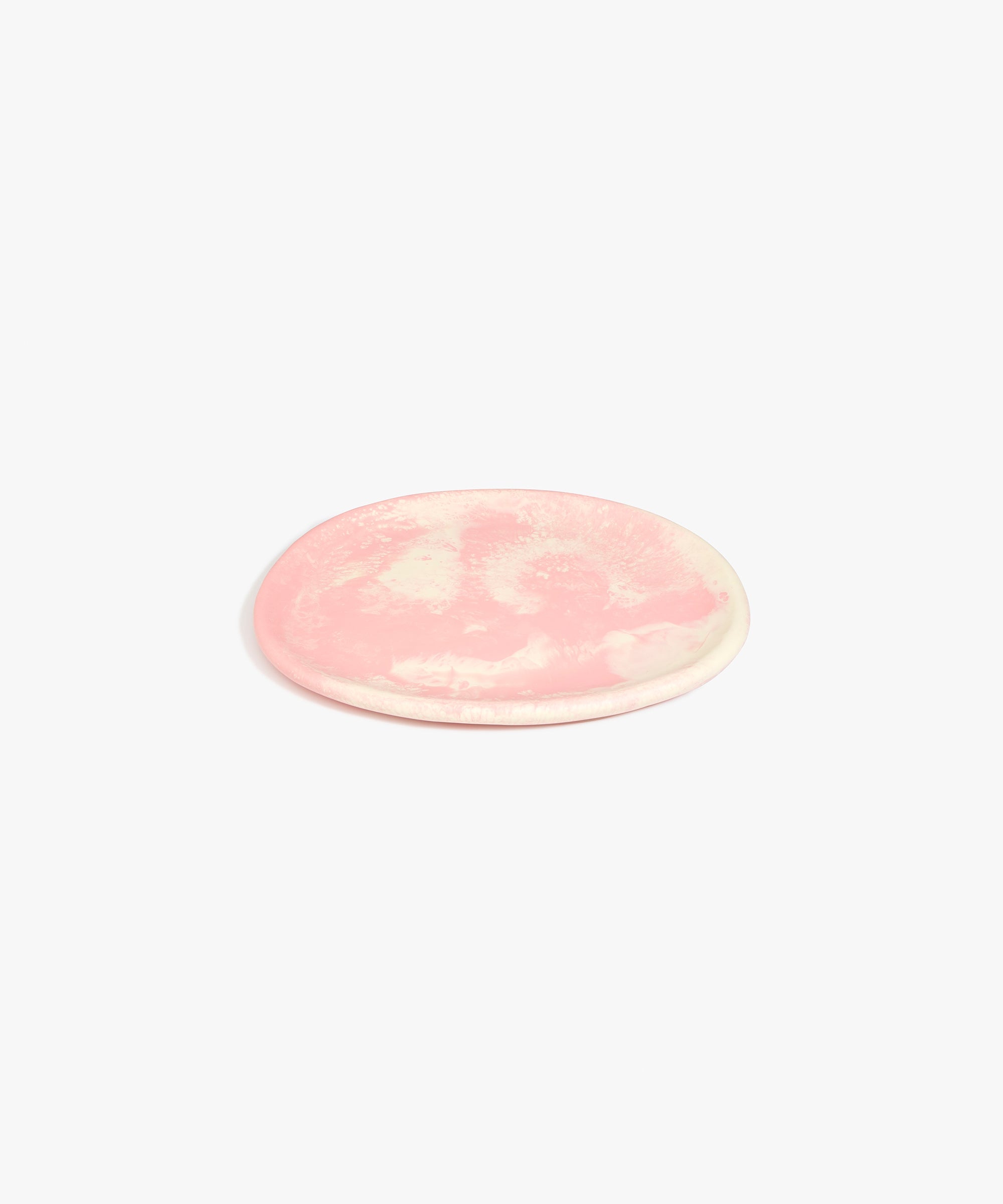 Dinosaur Designs Rock Plate in Blossom — handcrafted marbled pink and cream resin oval flat serving plate with rounded organic edge