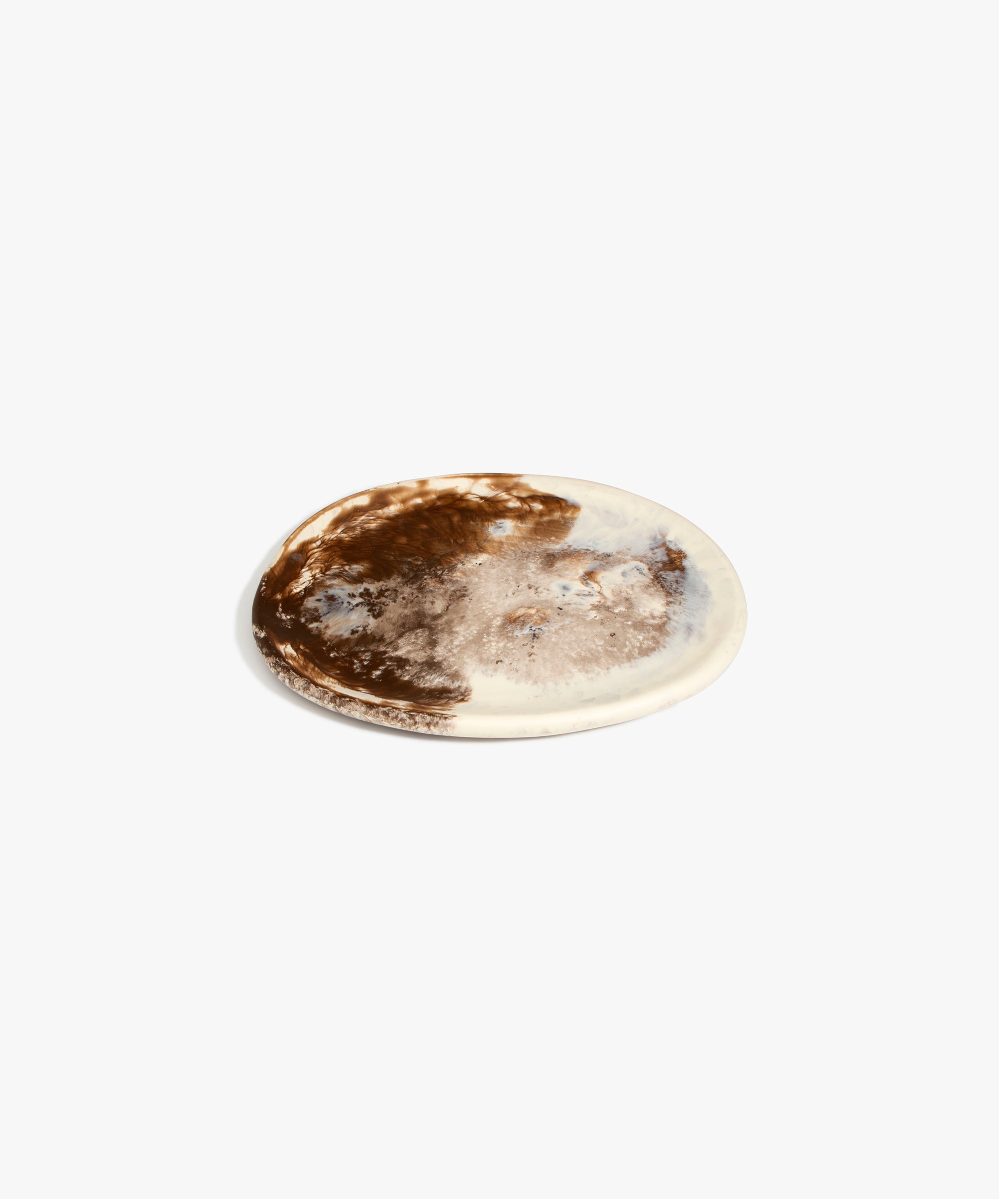 Dinosaur Designs Rock Plate in Cappuccino — handcrafted marbled brown and cream resin oval flat serving plate with rounded organic edge