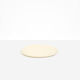 Dinosaur Designs Rock Plate in Cream — handcrafted cream resin oval flat serving plate with rounded organic edge