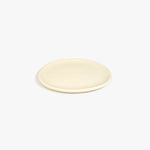 Dinosaur Designs Rock Plate in Cream — handcrafted cream resin oval flat serving plate with rounded organic edge