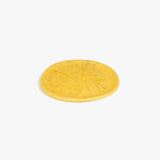 Dinosaur Designs Rock Plate in Pollen — handcrafted marbled yellow resin oval flat serving plate with rounded organic edge..