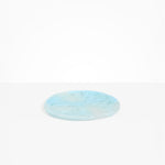 Dinosaur Designs Rock Plate in Pool — handcrafted marbled blue resin oval flat serving plate with rounded organic edge