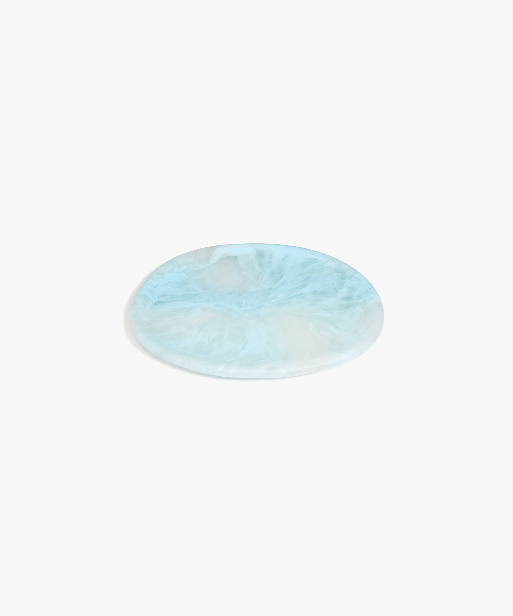 Dinosaur Designs Rock Plate in Pool — handcrafted marbled blue resin oval flat serving plate with rounded organic edge..