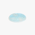 Dinosaur Designs Rock Plate in Pool — handcrafted marbled blue resin oval flat serving plate with rounded organic edge