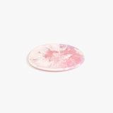 Dinosaur Designs Rock Plate in Shell Pink — handcrafted marbled pink resin oval flat serving plate with rounded organic edge