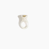 Dinosaur Designs Long Lily Ring in Chalk Swirl — handcrafted marbled off-white resin ring with sculptural swirled flower and brass bead
