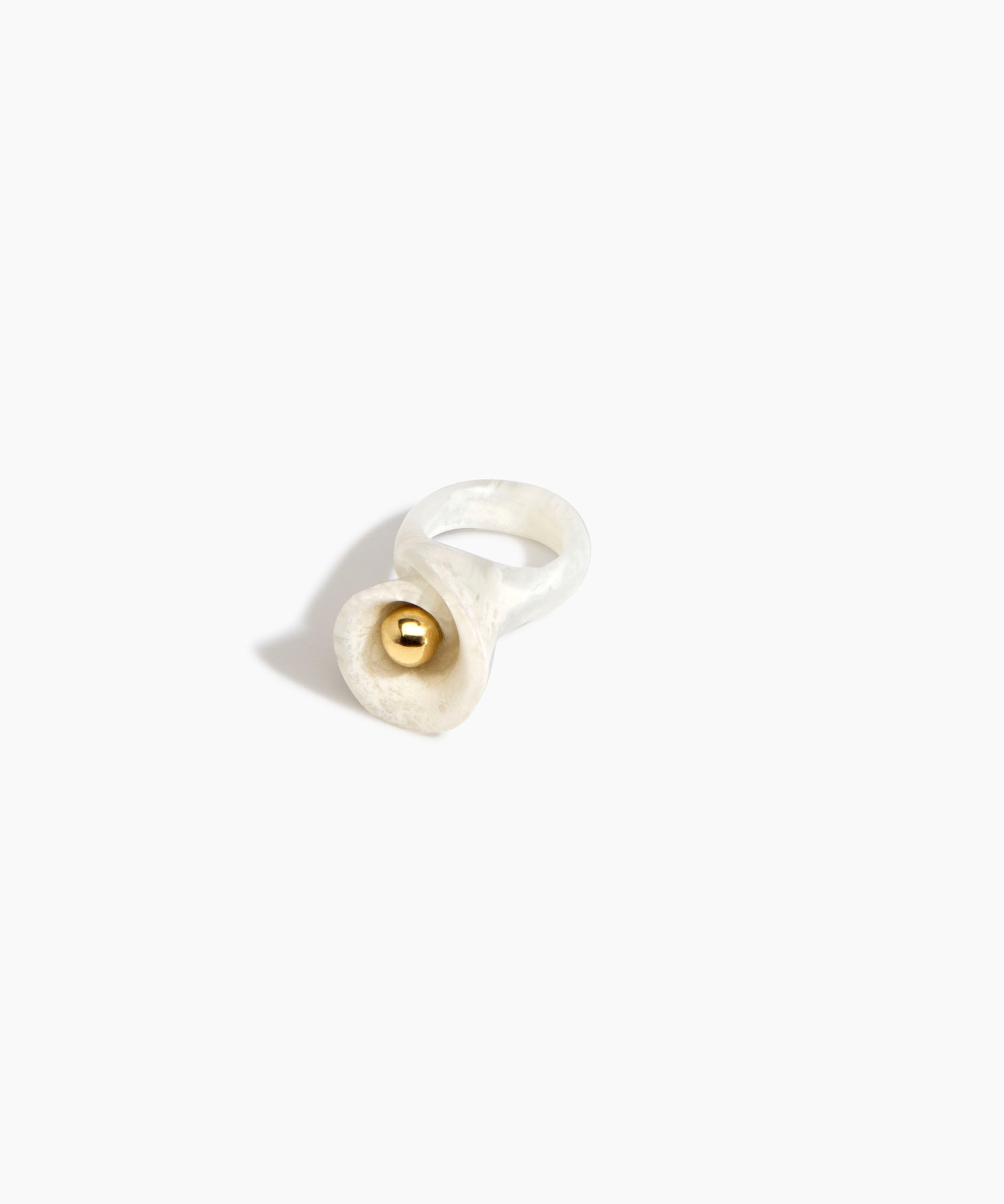 Dinosaur Designs Long Lily Ring in Chalk Swirl — handcrafted marbled off-white resin ring with sculptural swirled flower and brass bead