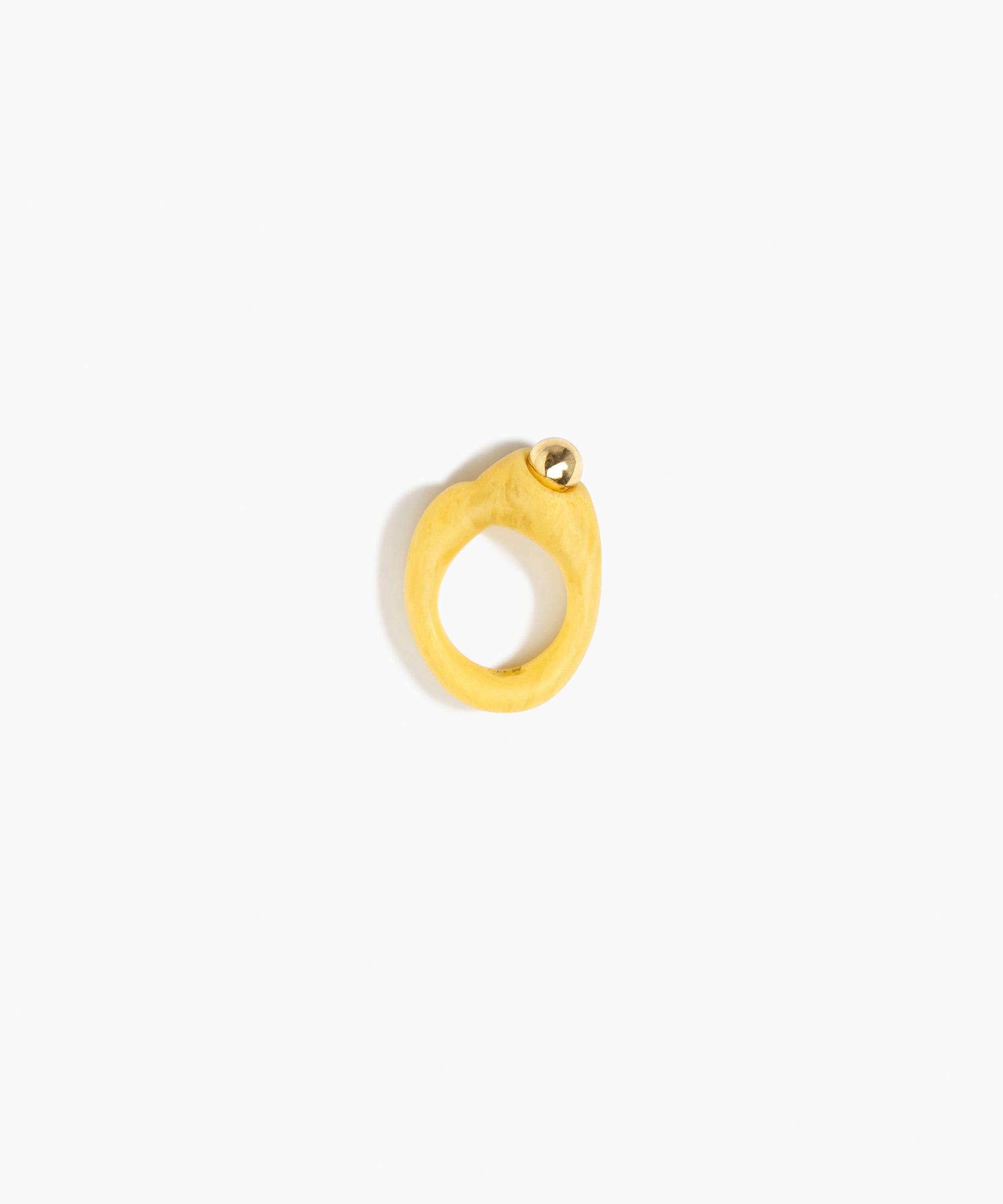 Dinosaur Designs Sprout Dot Ring in Pollen with Brass — handcrafted marbled yellow resin organic band ring with polished brass bead