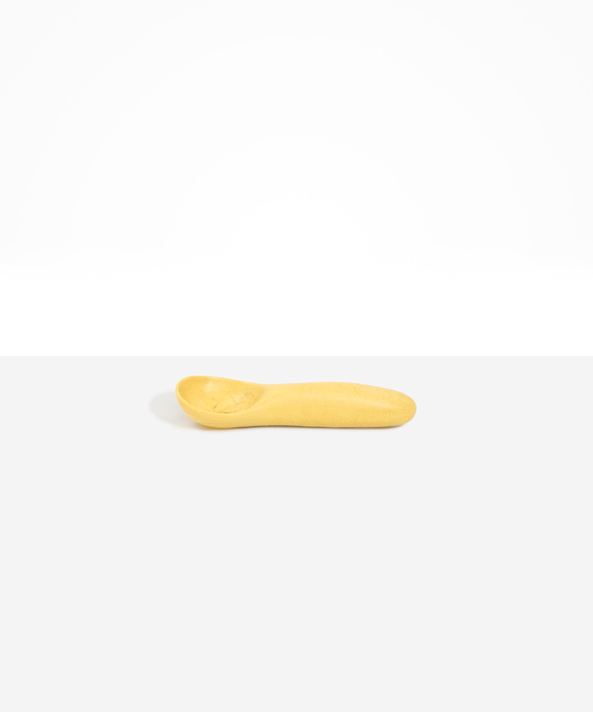 Dinosaur Designs Shell Gelato Scoop in Pollen — handcrafted marbled yellow resin ice cream scoop with deep rounded bowl and smooth cylindrical handle