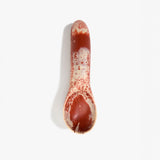 Dinosaur Designs Shell Gelato Scoop in Rust — handcrafted marbled terracotta red and cream resin ice cream scoop with deep rounded bowl and smooth cylindrical handle