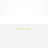 Dinosaur Designs Large Shell Spoon in Pistachio — handcrafted marbled pale green resin spoon with slender tapered handle