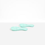 Dinosaur Designs Rock Servers in Mint — handcrafted marbled mint blue resin salad server set with rounded bulb handles, fork and spoon.