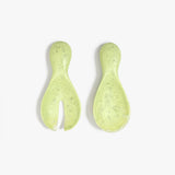 Dinosaur Designs Rock Servers in Pistachio — handcrafted marbled pale green resin salad server set with rounded bulb handles, fork and spoon.