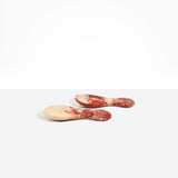 Dinosaur Designs Rock Servers in Rust — handcrafted marbled terracotta red and cream resin salad server set with rounded bulb handles, fork and spoon.