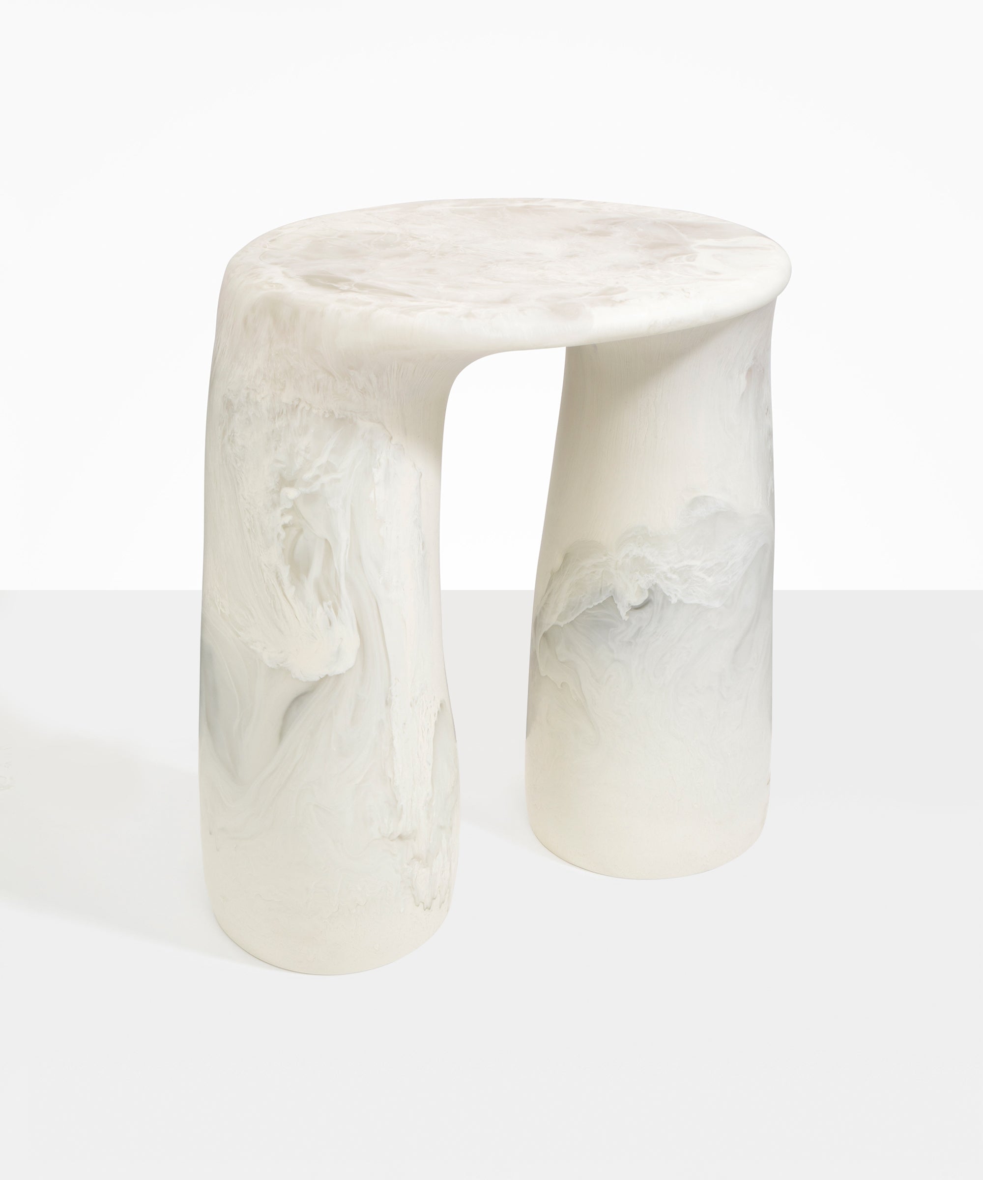 Dinosaur Designs Rock Tower Table in Chalk Swirl — handcrafted marbled off white and clear resin side table with oval top and two chunky rounded legs..