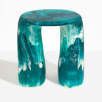 Dinosaur Designs Rock Tower Table in Lagoon — handcrafted marbled blue and cream resin side table with oval top and two chunky rounded legs..